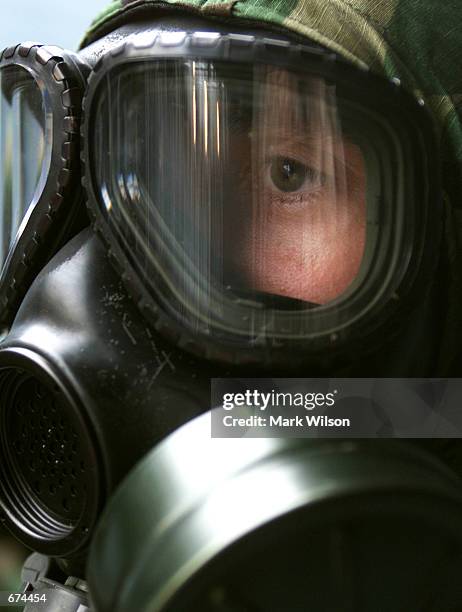 Marine waits to start a training exercise on chemical and biological response November 29, 2001 in Indian Head, Maryland. The Marines are from the...