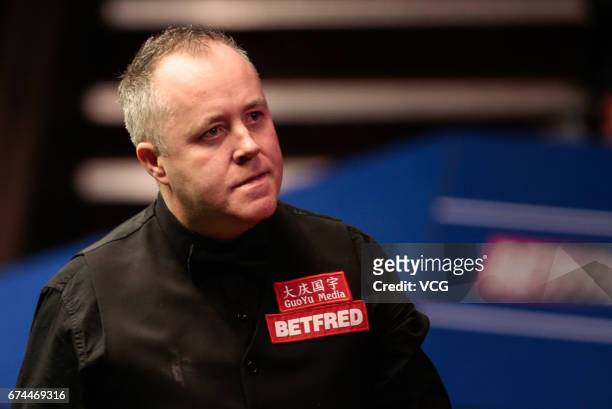 John Higgins of Scotland reacts during his semi-final match against Barry Hawkins of England on day 14 of Betfred World Championship 2017 at Crucible...