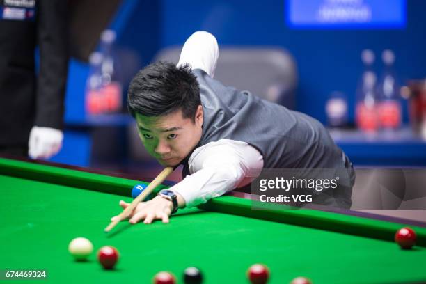 Ding Junhui of China plays a shot during his semi-final match against Mark Selby of England on day 14 of Betfred World Championship 2017 at Crucible...
