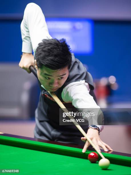 Ding Junhui of China plays a shot during his semi-final match against Mark Selby of England on day 14 of Betfred World Championship 2017 at Crucible...