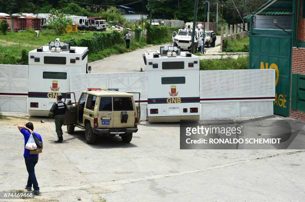 Venezuelan National Guard riot control vehicles block the access to the Ramo Verde prison in Los Teques, 30 km east of Caracas, where opposition...