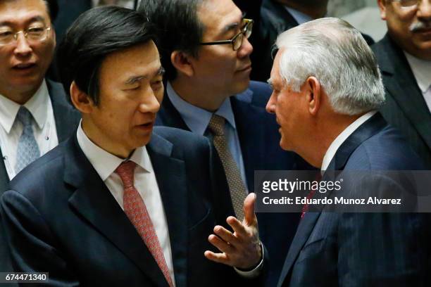 South Korean Foreign Minister Yun Byung Se speaks with US Secretary of State Rex Tillerson at the end of the security council meeting on...