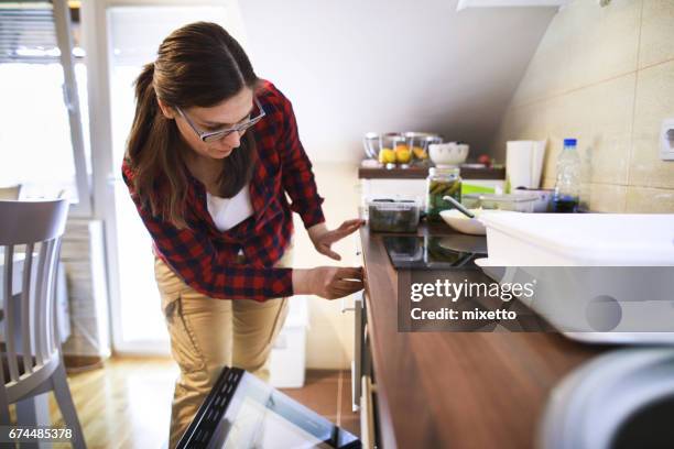 women including  on the induction cooktops - electric stove burner stock pictures, royalty-free photos & images