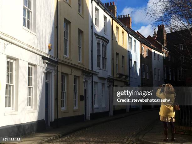 woman taking a photograph - stevebphotography stock pictures, royalty-free photos & images