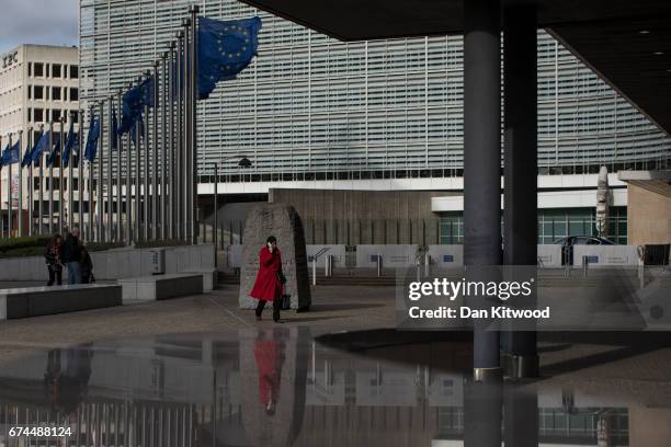 Woman walks past the European Union Commission headquarters on April 28, 2017 in Brussels, Belgium. The 27 members of the European Union will meet in...