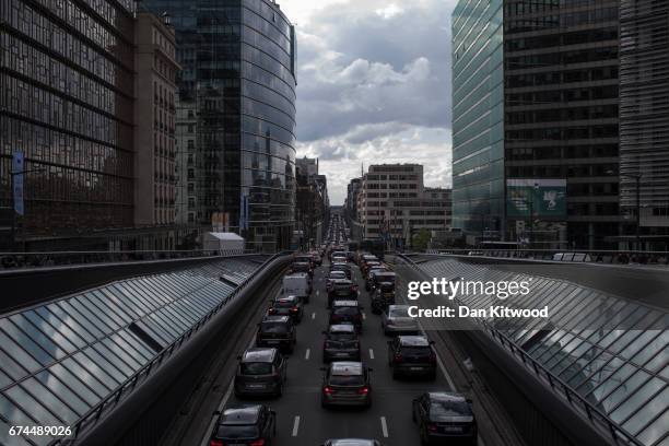 Rush hour traffic slowly makes its way through central Brussels past the European Union Commission headquarters on April 28, 2017 in Brussels,...