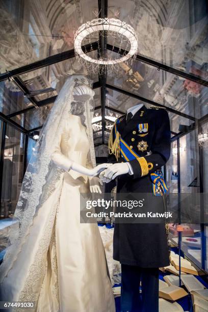 King Willem-Alexander of the Netherlands' wedding suit and Queen Maxima of the Netherlands' wedding dress on display at the exhibition in the Royal...