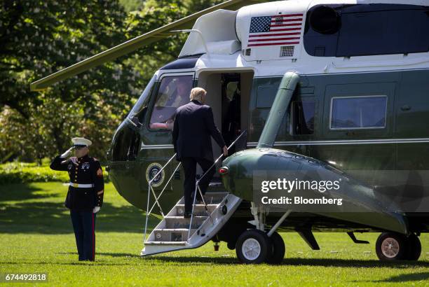 President Donald Trump boards Marine One to depart for the National Rifle Association leadership forum on the South Lawn of the White House in...