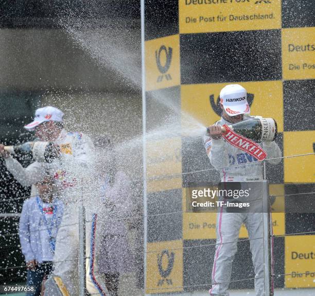 Lucas Auer, Edoardo Mortara and Marco Wittmann celebrates winning the second race of the DTM 2016 German Touring Car Championship at Nuerburgring on...