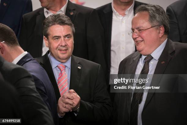 German Foreign Minister and Vice Chancellor Sigmar Gabriel talks with Nikos Kotzias , Foreign Minister of Greece, before the family photo at the...