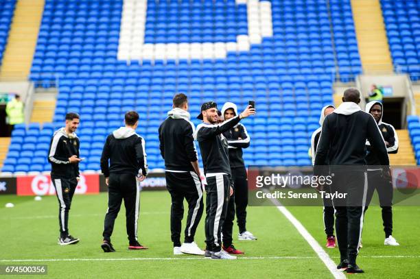 Achraf Lazaar of Newcastle United stands on the pitch taking a selfie prior to kick off of the Sky Bet Championship match between Cardiff City and...