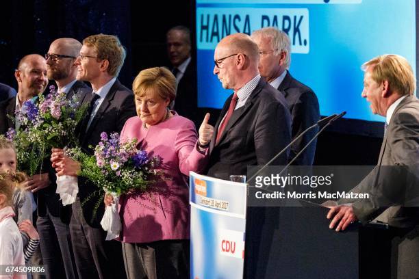 German Chancellor and Chairwoman of the German Christian Democrats Angela Merkel gestures as she's on stage with local CDU lead candidate Daniel...