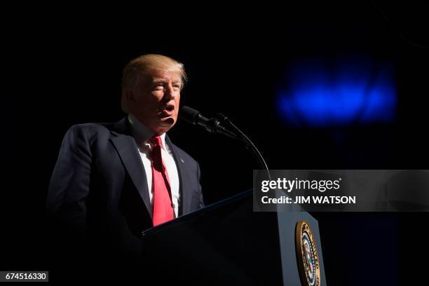 President Donald Trump arrives to address the National Rifle Association Leadership Forum in Atlanta, Georgia on April 28, 2017. / AFP PHOTO / JIM...