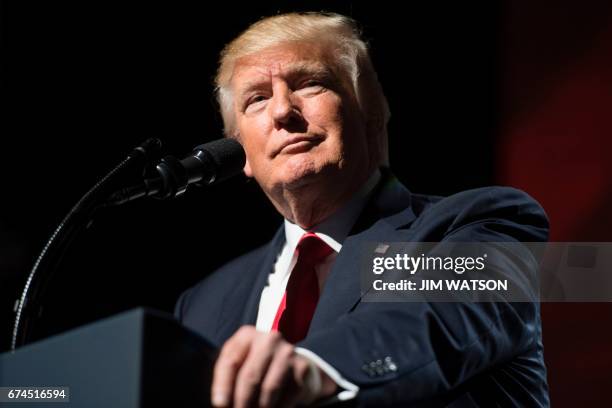 President Donald Trump arrives to address the National Rifle Association Leadership Forum in Atlanta, Georgia on April 28, 2017. / AFP PHOTO / JIM...