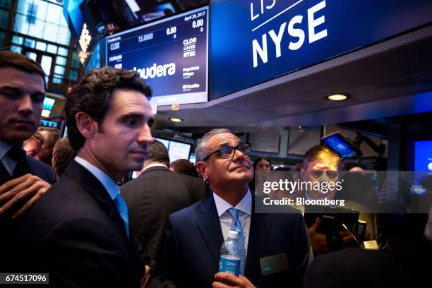 Ernie Garcia III, founder and chief executive officer of Carvana Co., second left, and his father Ernest Garcia II, chairman of Carvana Co., center,...