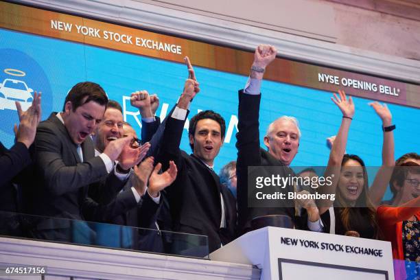 Ernie Garcia, founder and chief executive officer of Carvana Co., center, rings the opening bell during the company's initial public offering on the...