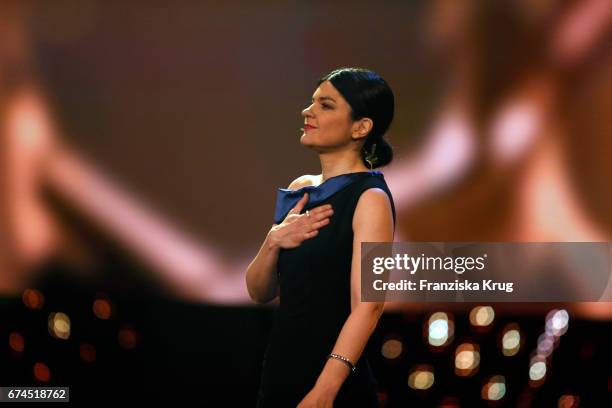 Jasmin Tabatabai, host of the Awards, on stage at the Lola - German Film Award show at Messe Berlin on April 28, 2017 in Berlin, Germany.