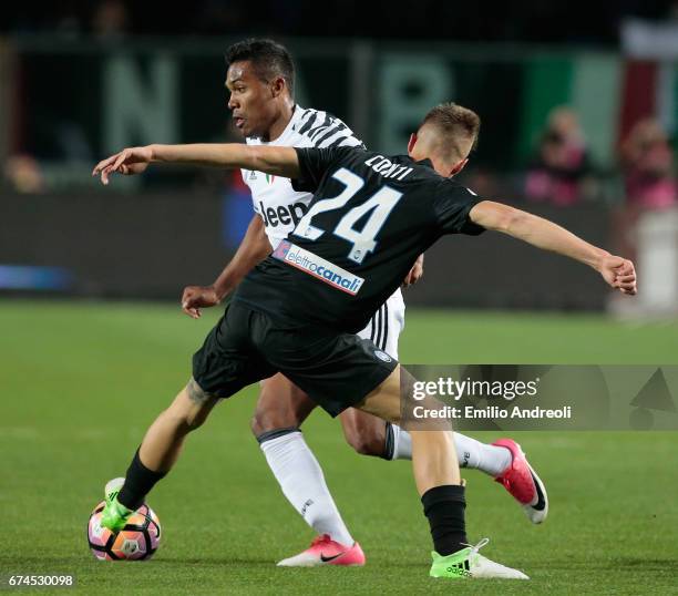 Alex Sandro of Juventus FC competes for the ball with Andrea Conti of Atalanta BC during the Serie A match between Atalanta BC and Juventus FC at...