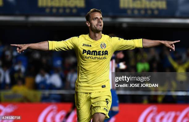 Villarreal's forward Roberto Soldado celebrates a goal during the Spanish league football match Villarreal CF vs Real Sporting de Gijon at La...