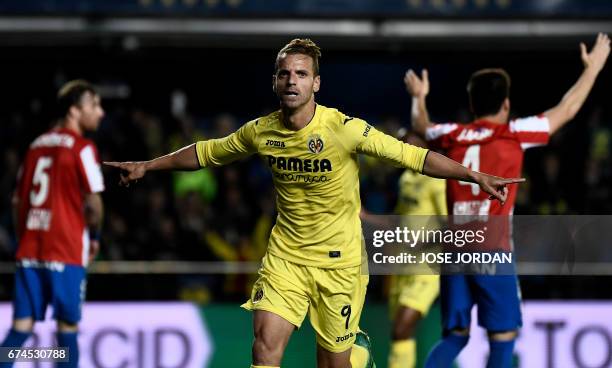 Villarreal's forward Roberto Soldado celebrates a goal during the Spanish league football match Villarreal CF vs Real Sporting de Gijon at La...