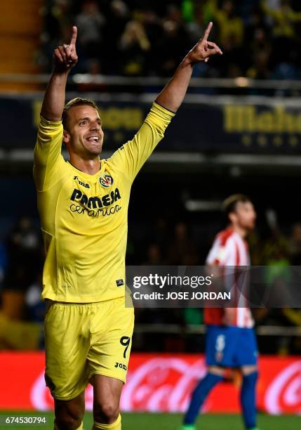 Villarreal's forward Roberto Soldado celebrates a goal during the Spanish league football match Villarreal CF vs Real Sporting de Gijon at La...
