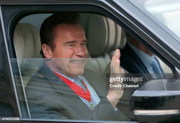 Actor and former US Govenor of California Arnold Schwarzenegger leaves the Elysee Palace after receiving his 'Chevalier de la Legion d'Honneur'...