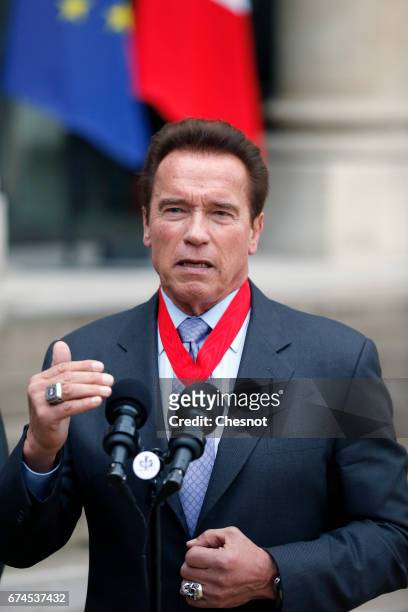 Actor and former US Governor of California Arnold Schwarzenegger makes a statement after receiving his 'Chevalier de la Legion d'Honneur' medal, by...