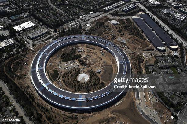 An aerial view of the new Apple headquarters on April 28, 2017 in Cupertino, California. Apple's new 'spaceship' 175-acre campus dubbed "Apple Park"...