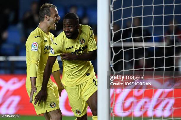 Villarreal's Congolese forward Cedric Bakambu celebrates a goal beside Villarreal's forward Roberto Soldado during the Spanish league football match...