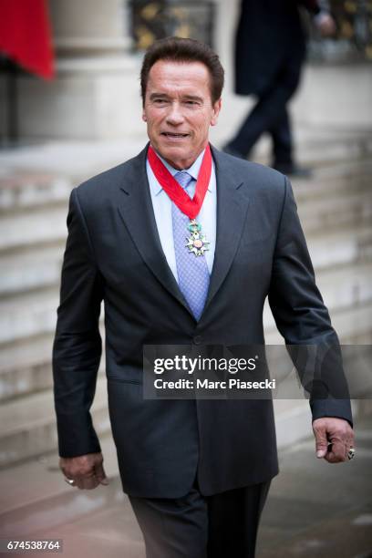Arnold Schwarzenegger speaks to the press after being awarded France's highest national order the 'Chevalier de la Legion d'Honneur' by french...