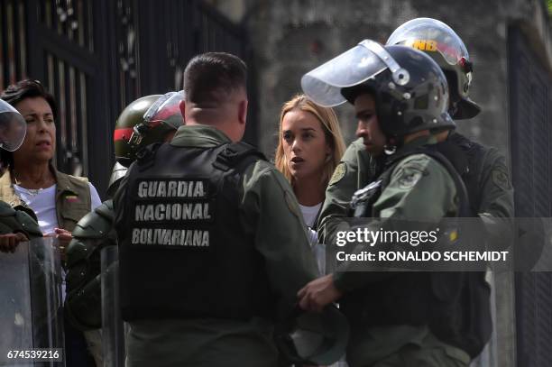 Jailed opposition leader Leopoldo Lopez's wife Lilian Tintori and mother Antonieta Mendoza de Lopez are stopped by the National Guard 500 metres from...