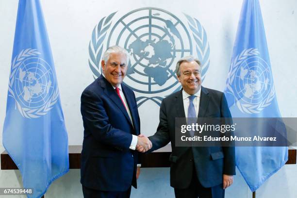 Secretary of State Rex Tillerson shakes hands with United Nations Secretary General Antonio Guterres before a meeting at the UN headquarters on April...