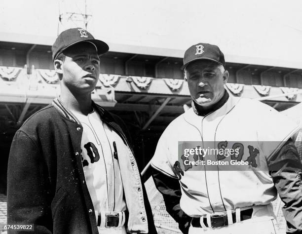 Boston Red Sox player Reggie Smith, left, and first base coach Bobby Doerr are pictured at Fenway Park in Boston on opening day of the 1967 Red Sox...