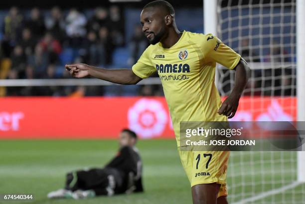 Villarreal's Congolese forward Cedric Bakambu celebrates after scoring a goal during the Spanish league football match Villarreal CF vs Real Sporting...