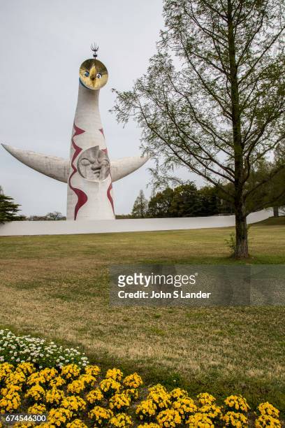Tower of the Sun at Osaka Expo Park is about 65 meters high with three faces; The Golden Mask is on top made of a round steel plate, the Face of the...