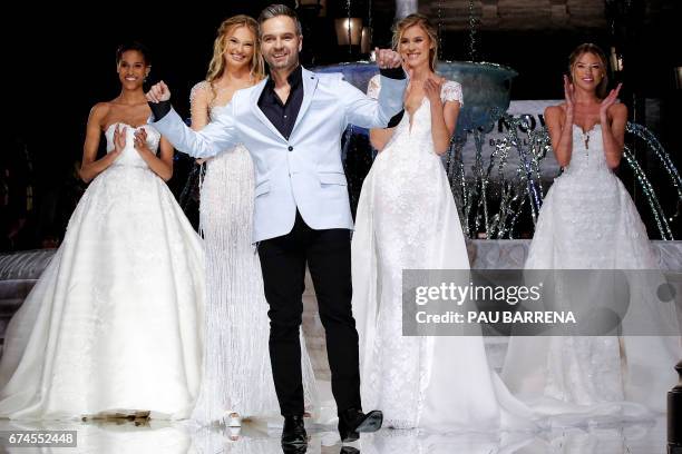 French designer Herve Moreau poses with French model Cindy Bruna, Dutch model Romee Strijd, US model Martha Seifert Hunt and Dutch model Bregje...