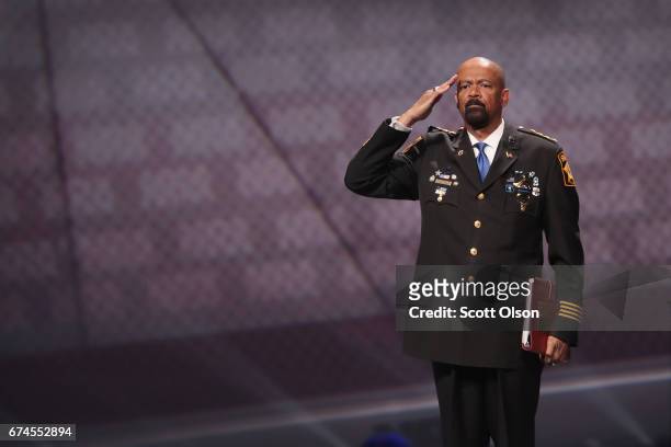 David Clarke Jr., sheriff of Milwaukee County, Wisconsin, salutes as he leaves the stage after speaking at the NRA-ILA's Leadership Forum at the...