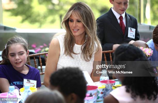 First lady Melania Trump works on an art project with young children at the Children's National Health System April 28, 2017 in Washington, DC. Trump...