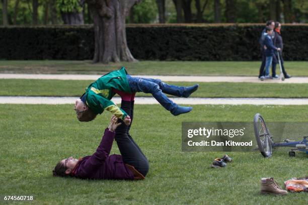 Woman and child play in a park on April 28, 2017 in Brussels, Belgium. The 27 members of the European Union will meet in Brussels tomorrow for a...