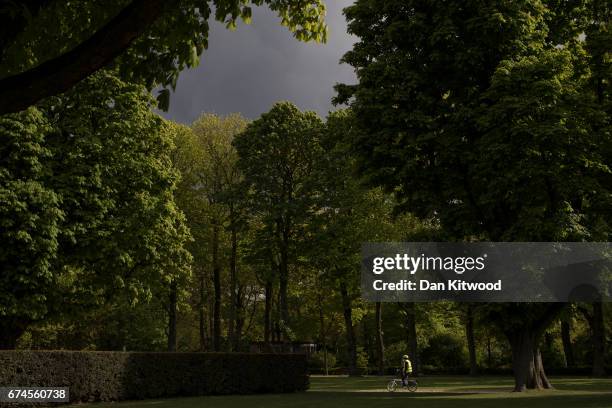 Man cycles through a park on April 28, 2017 in Brussels, Belgium. The 27 members of the European Union will meet in Brussels tomorrow for a special...