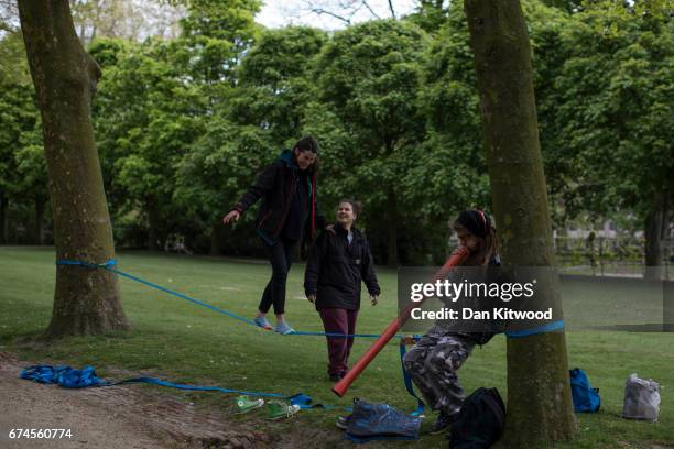 Group take turns balancing on a slackline in a park on April 28, 2017 in Brussels, Belgium. The 27 members of the European Union will meet in...