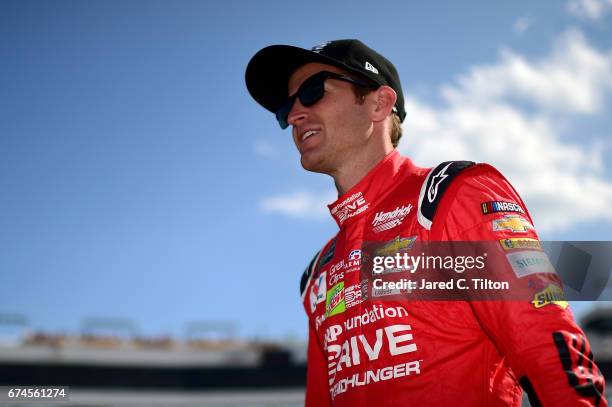 Kasey Kahne, driver of the AARP Drive to End Hunger Chevrolet, walks down the grid during qualifying for the Monster Energy NASCAR Cup Series Toyota...