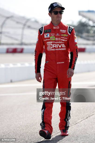 Kasey Kahne, driver of the AARP Drive to End Hunger Chevrolet, walks down the grid during qualifying for the Monster Energy NASCAR Cup Series Toyota...