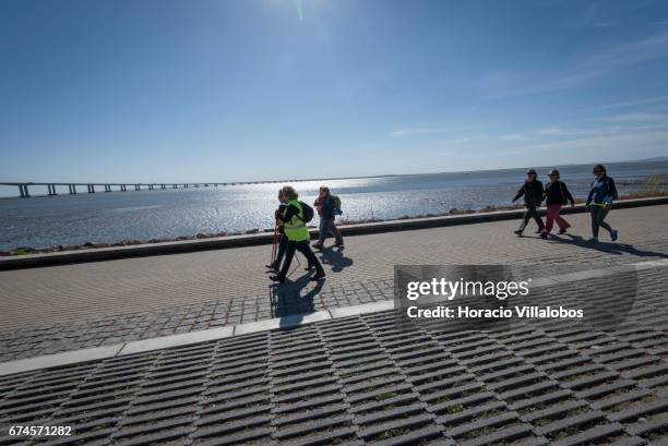 Pilgrims walk by Parque das Nacoes, starting point of the 'Camino do Tejo' , a 139 km trail, from Lisbon to Fatima Sanctuary on April 27, 2017 in...