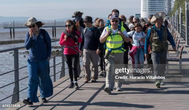 Pilgrims walk by Parque das Nacoes, starting point of the 'Camino do Tejo' , a 139 km trail, from Lisbon to Fatima Sanctuary on April 27, 2017 in...