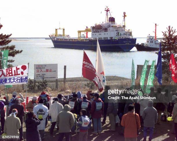 Nuclear transport ship Pacific Teal is seen on arrival at Mutsu Ogawara Port while anti-nuclear protesters hold a rally on March 18, 1997 in...