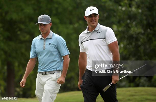 Chase Koepka and Brooks Koepka walk up the fairway during the second round of the Zurich Classic at TPC Louisiana on April 28, 2017 in Avondale,...