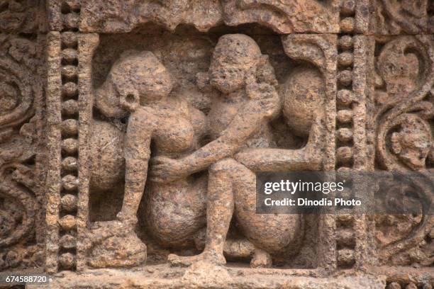 erotic sculpture on sun temple, konark, orissa, india, asia - konark temple foto e immagini stock