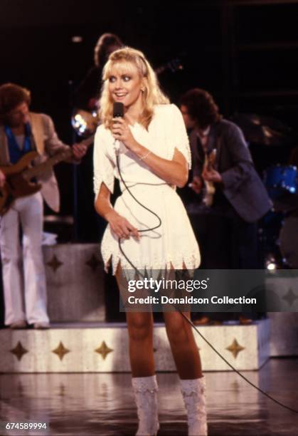 Musician Olivia Newton-John performs on the "Hollywood Nights" TV special in March 1980 in Los Angeles, California.
