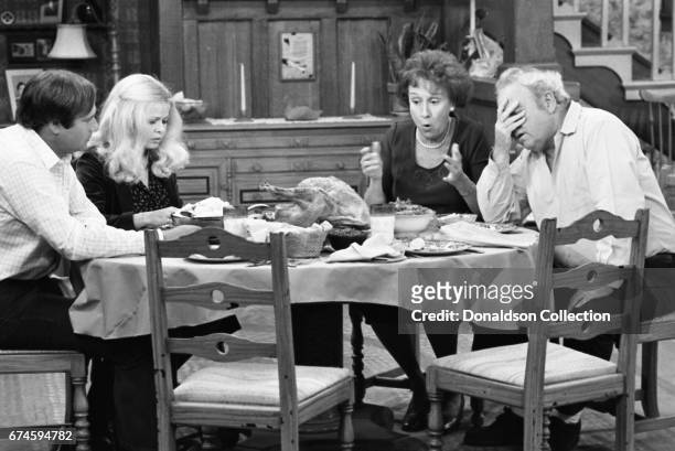 Rob Reiner, Sally Struthers, Carroll O'Connor and Jean Stapleton acting on the set of "All in the Family" TV show in 1978 in Los Angeles, California.